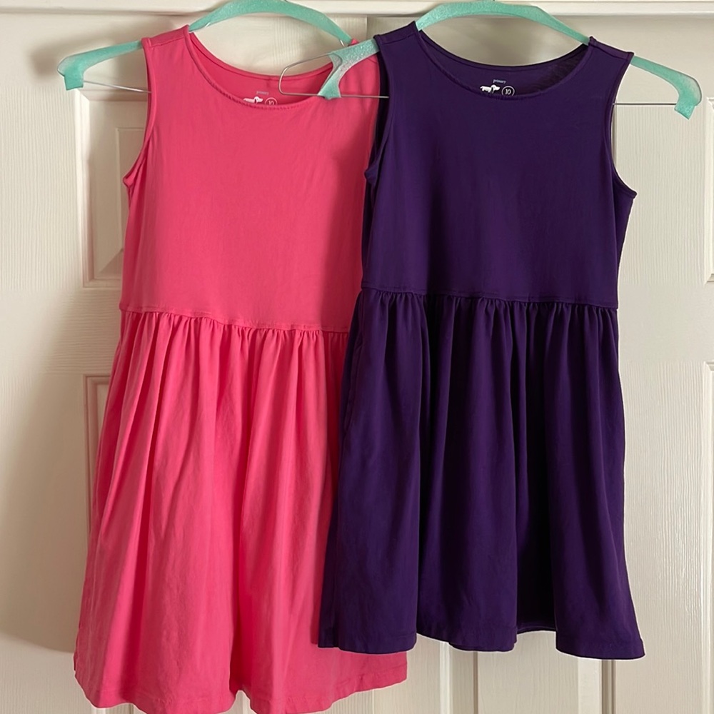 2 Primary size 10 pink and purple Recess dresses.